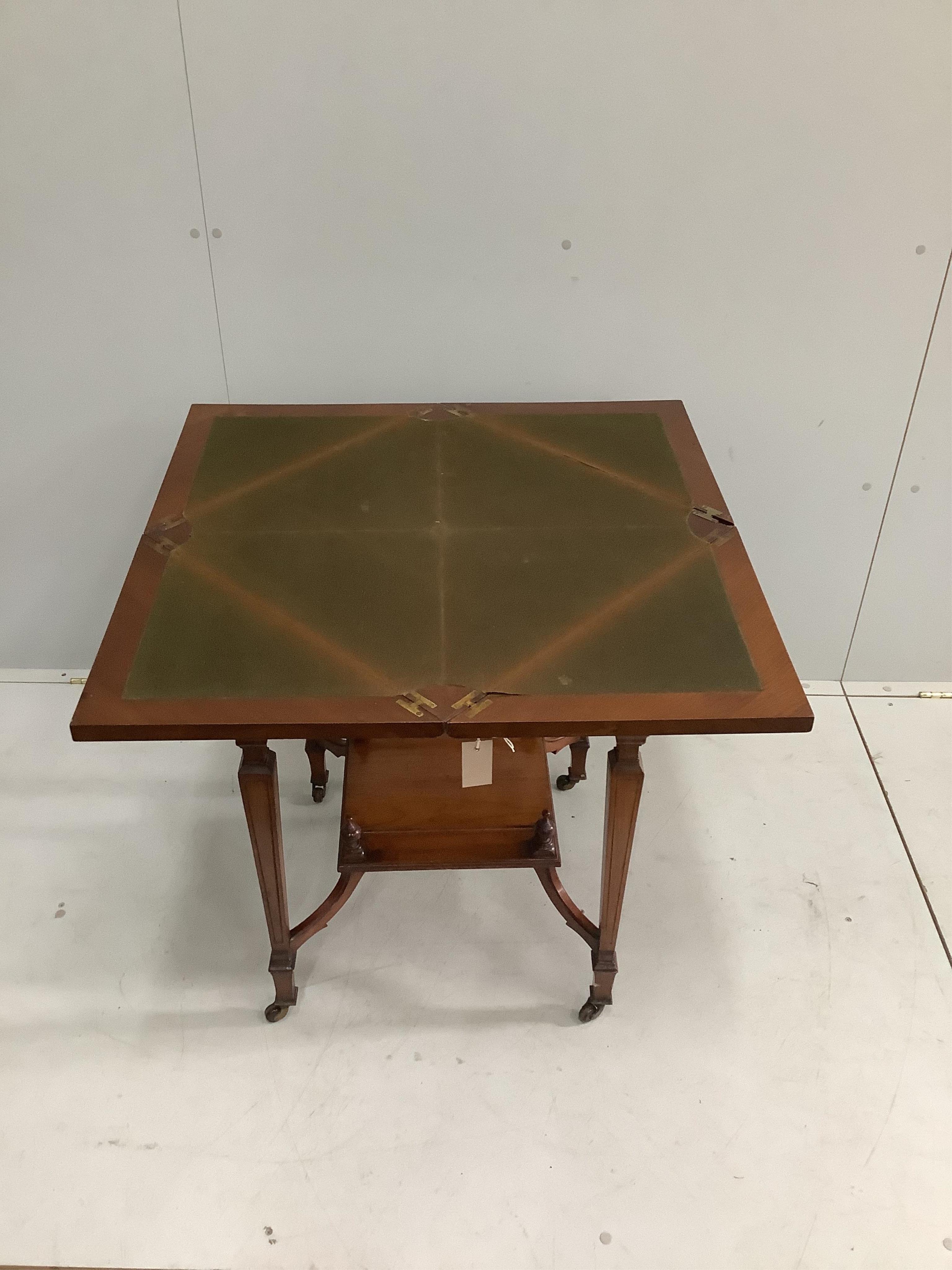 A late Victorian walnut envelope card table, width 56cm, height 74cm. Condition - fair